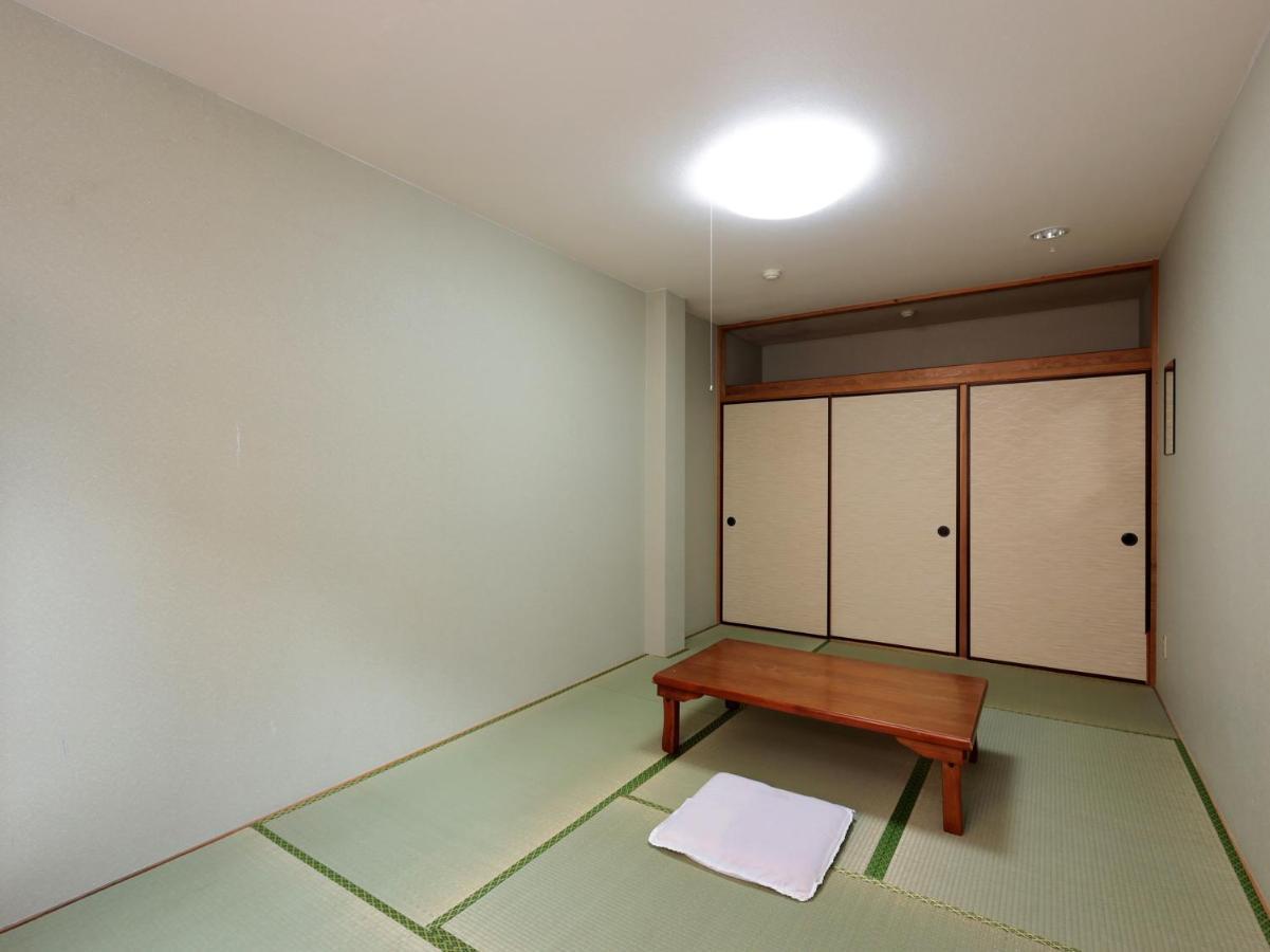 Отель Tabist Izumi Yusen Shukuhaku Center Экстерьер фото