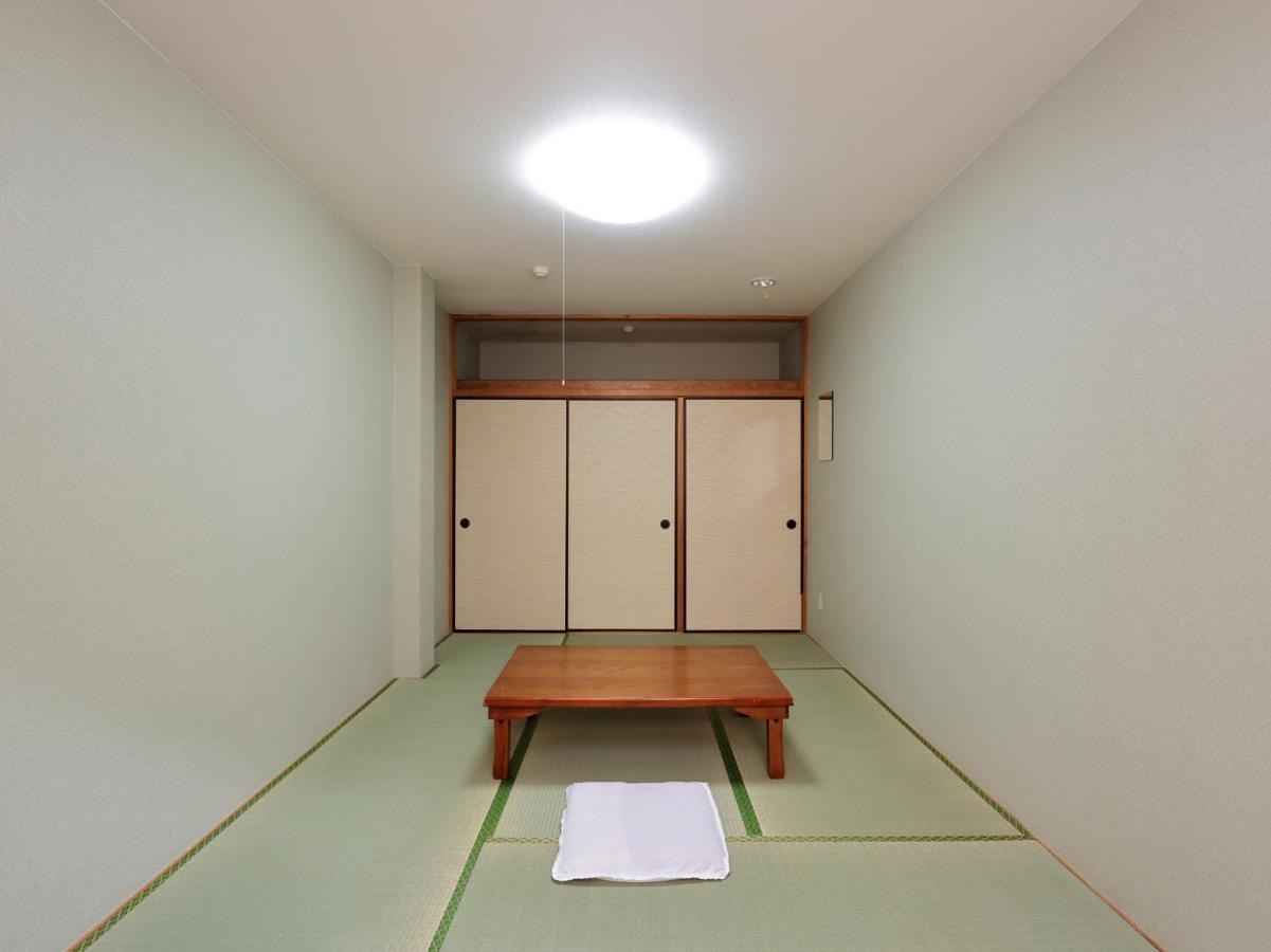 Отель Tabist Izumi Yusen Shukuhaku Center Экстерьер фото